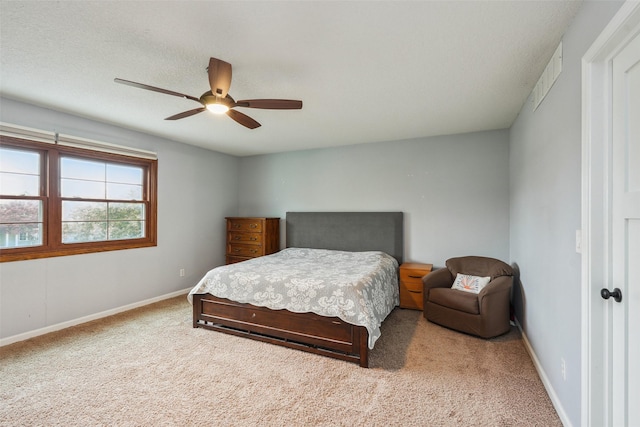 9905 Mcwilliams Dr, Johnston, IA 50131 - bedroom featuring carpet flooring, baseboards, and a ceiling fan