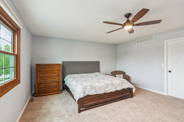 9905 Mcwilliams Dr, Johnston, IA 50131 - bedroom featuring carpet floors, baseboards, and a ceiling fan