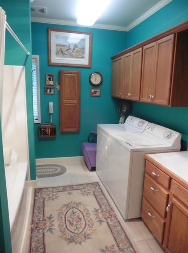 322 S Temple St, Osceola, IA 50213 - washroom with cabinet space, separate washer and dryer, ornamental molding, and light tile patterned flooring