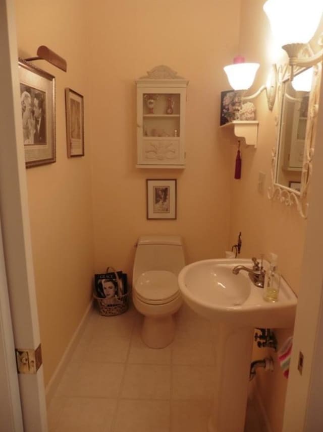 bathroom featuring tile patterned floors and toilet