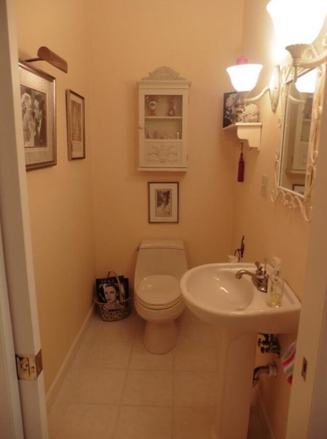 322 S Temple St, Osceola, IA 50213 - half bathroom with tile patterned floors and toilet