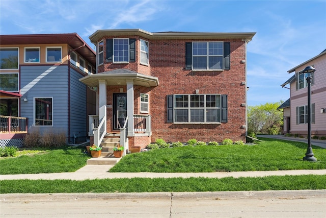 8419 Long Meadow Ln, Johnston, IA 50131 - view of front of home featuring brick siding and a front lawn