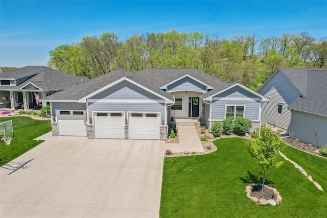 1101 Timber Valley Dr, Polk City, IA 50226 - view of front of house featuring stone siding, an attached garage, concrete driveway, and a front yard