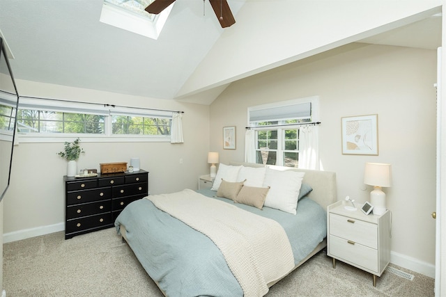 2620 35th St, Des Moines, IA 50310 - bedroom featuring a skylight, light colored carpet, baseboards, lofted ceiling, and a ceiling fan