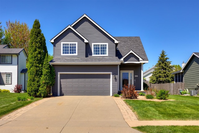 15919 Hawthorn Cir, Clive, IA 50325 - traditional home featuring an attached garage, driveway, and cooling unit
