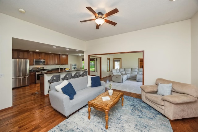 15919 Hawthorn Cir, Clive, IA 50325 - living area with dark wood finished floors, ceiling fan, and recessed lighting