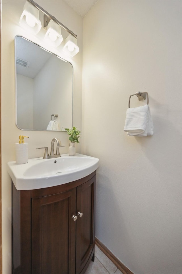 15919 Hawthorn Cir, Clive, IA 50325 - bathroom with vanity, tile patterned flooring, and baseboards