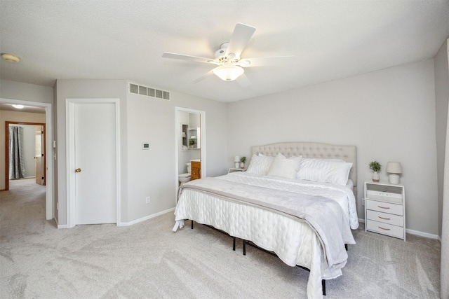 15919 Hawthorn Cir, Clive, IA 50325 - bedroom featuring carpet, baseboards, ceiling fan, and connected bathroom
