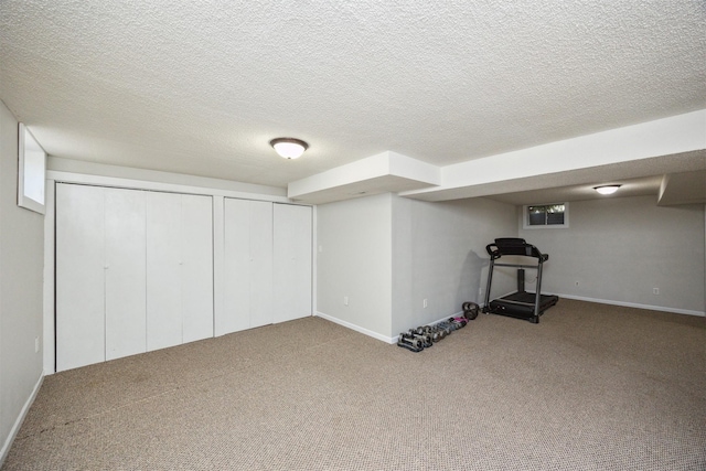 15919 Hawthorn Cir, Clive, IA 50325 - finished basement featuring carpet flooring, baseboards, and a textured ceiling