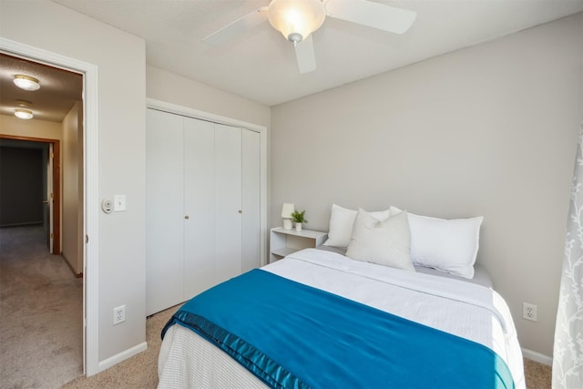 15919 Hawthorn Cir, Clive, IA 50325 - carpeted bedroom featuring a closet, baseboards, and a ceiling fan