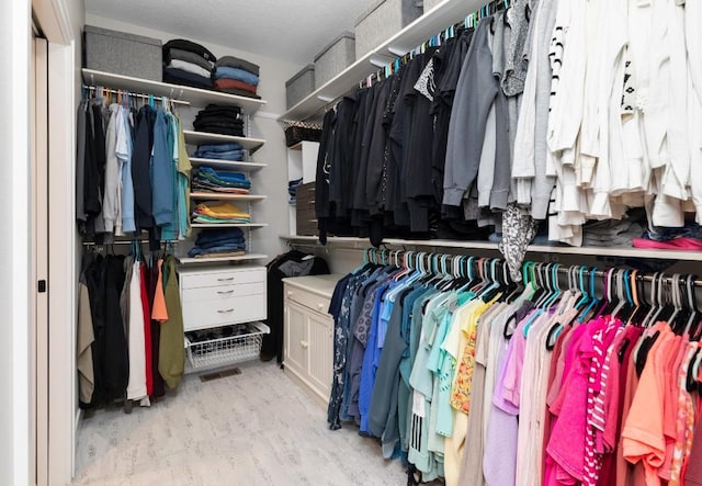 2113 NE Heritage Dr, Grimes, IA 50111 - walk in closet with wood finished floors