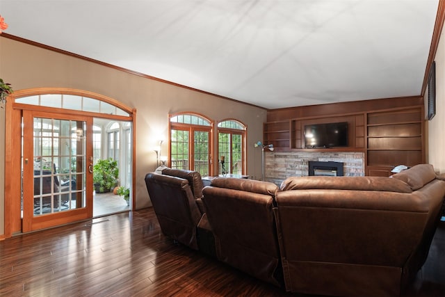 1608 W Lincoln Way, Marshalltown, IA 50158 - living room featuring ornamental molding, a stone fireplace, and wood finished floors