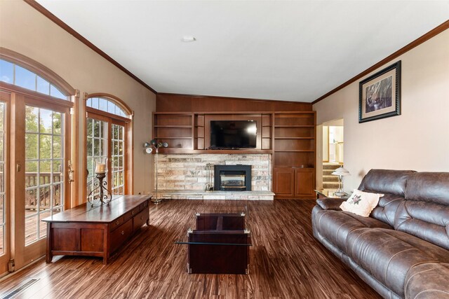 1608 W Lincoln Way, Marshalltown, IA 50158 - living area featuring crown molding, a stone fireplace, dark wood-style floors, and built in features