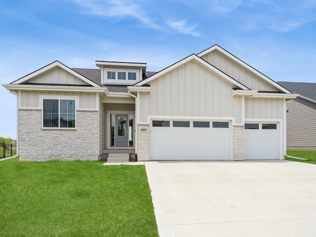 460 NW Gracewood Dr, Waukee, IA 50263 - view of front facade with stone siding, a garage, concrete driveway, board and batten siding, and roof with shingles