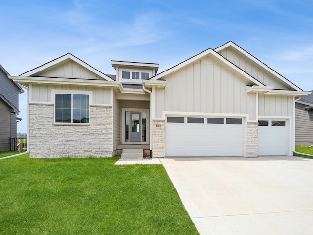 460 NW Gracewood Dr, Waukee, IA 50263 - view of front of property with stone siding, an attached garage, board and batten siding, and concrete driveway