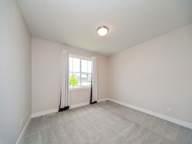 460 NW Gracewood Dr, Waukee, IA 50263 - empty room with light carpet and baseboards
