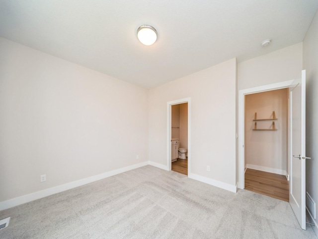 460 NW Gracewood Dr, Waukee, IA 50263 - unfurnished bedroom featuring carpet flooring, baseboards, and ensuite bath