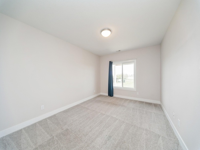460 NW Gracewood Dr, Waukee, IA 50263 - empty room featuring light colored carpet and baseboards