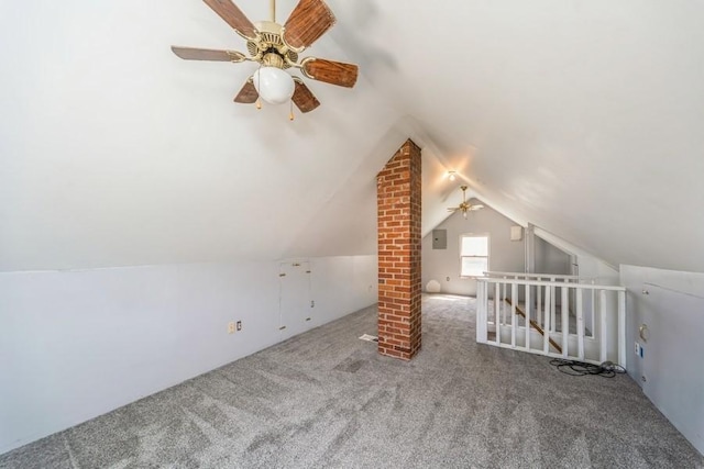 bonus room with a ceiling fan, carpet floors, and vaulted ceiling