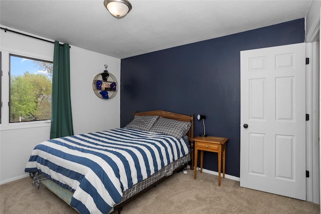 7422 Plum Dr, Urbandale, IA 50322 - carpeted bedroom with baseboards