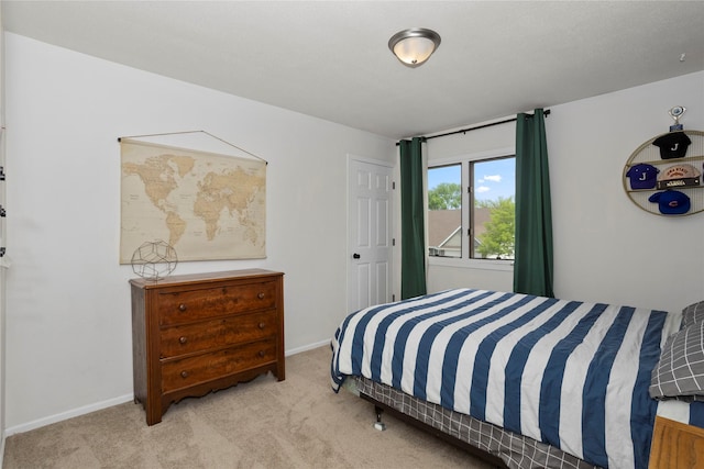 7422 Plum Dr, Urbandale, IA 50322 - bedroom featuring carpet floors and baseboards