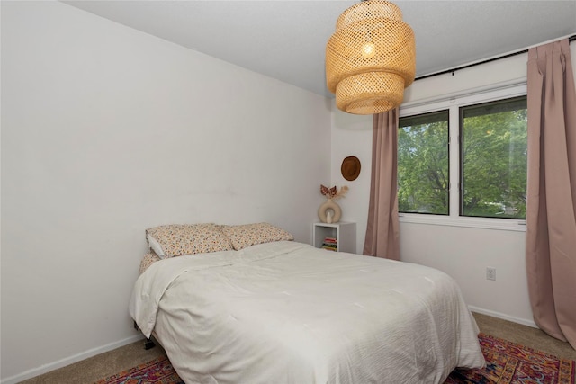 7422 Plum Dr, Urbandale, IA 50322 - bedroom featuring carpet flooring and baseboards