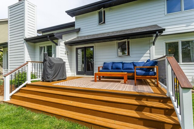 7422 Plum Dr, Urbandale, IA 50322 - wooden deck featuring an outdoor living space and area for grilling