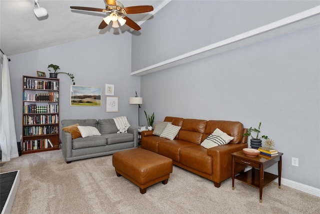 7422 Plum Dr, Urbandale, IA 50322 - carpeted living room featuring lofted ceiling, a ceiling fan, and baseboards