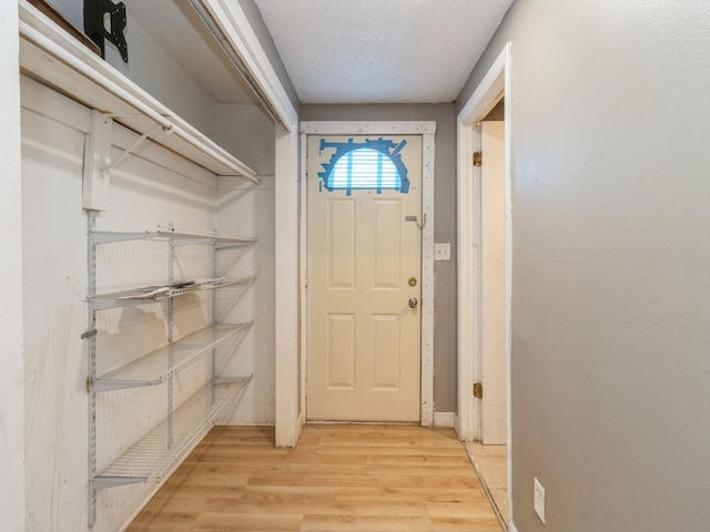 doorway to outside with light wood finished floors
