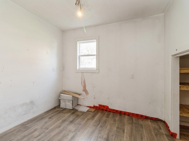 spare room with wood finished floors