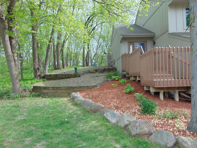 7120 Hickory Ln, Urbandale, IA 50322 - view of green lawn with a wooden deck