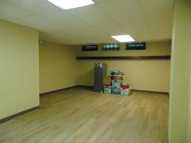 7120 Hickory Ln, Urbandale, IA 50322 - finished basement with a drop ceiling, wood finished floors, and baseboards