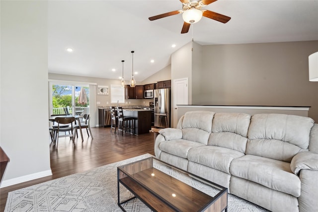living room with ceiling fan, vaulted ceiling, dark wood-style flooring, recessed lighting, and baseboards