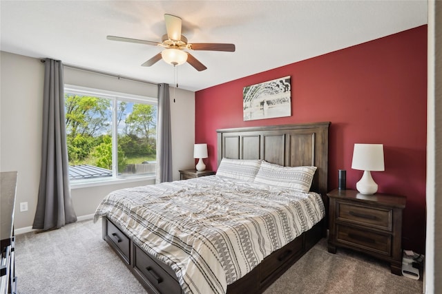 carpeted bedroom with baseboards and a ceiling fan