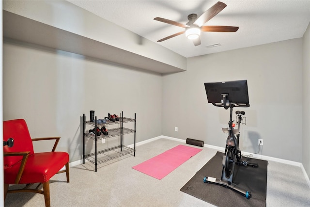 workout room featuring ceiling fan, baseboards, and carpet floors