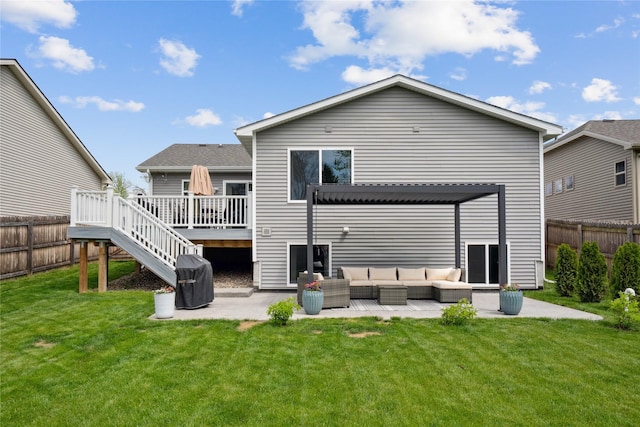 rear view of property featuring a deck, an outdoor living space, a patio area, and stairs