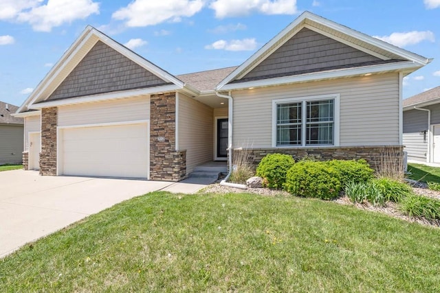 312 Evergreen Dr NW, Bondurant, IA 50035 - craftsman house featuring stone siding, concrete driveway, an attached garage, and a front lawn