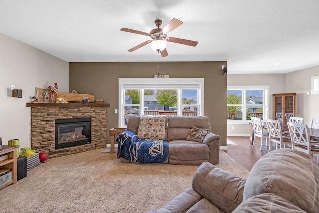312 Evergreen Dr NW, Bondurant, IA 50035 - living room with a ceiling fan and a fireplace