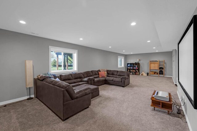 312 Evergreen Dr NW, Bondurant, IA 50035 - living room featuring carpet, recessed lighting, and baseboards