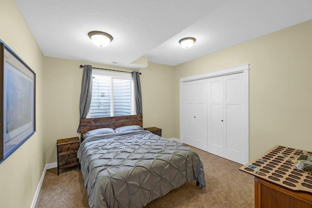 312 Evergreen Dr NW, Bondurant, IA 50035 - carpeted bedroom featuring a closet and baseboards