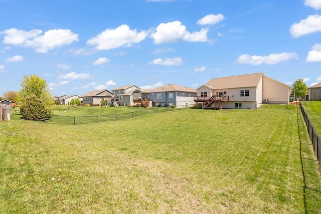 312 Evergreen Dr NW, Bondurant, IA 50035 - view of yard with a residential view, stairway, and a deck