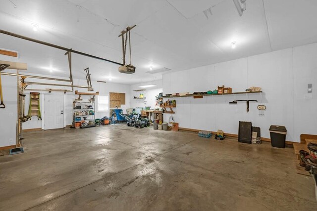 312 Evergreen Dr NW, Bondurant, IA 50035 - garage with a garage door opener