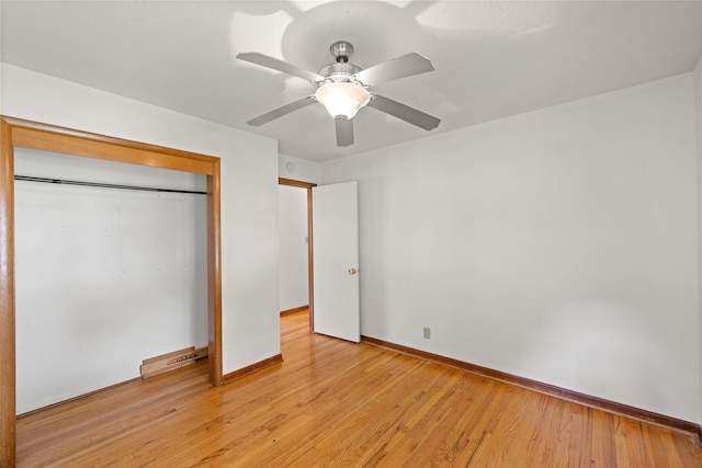 unfurnished bedroom featuring baseboards, light wood finished floors, a closet, and a ceiling fan