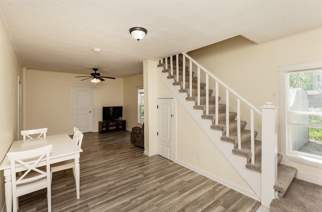 1915 E 22nd St, Des Moines, IA 50317 - stairway with wood finished floors and ceiling fan