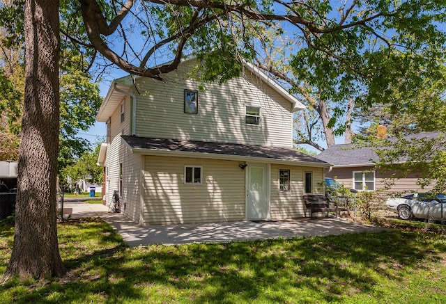 1915 E 22nd St, Des Moines, IA 50317 - back of house with a patio and a yard