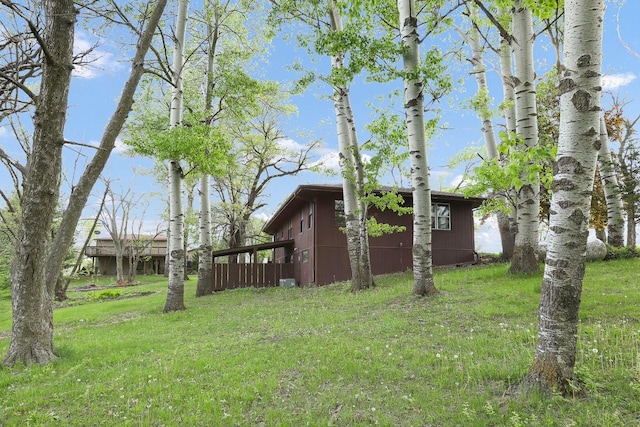 2226 Idaho Dr, Pella, IA 50219 - view of green lawn featuring an outbuilding