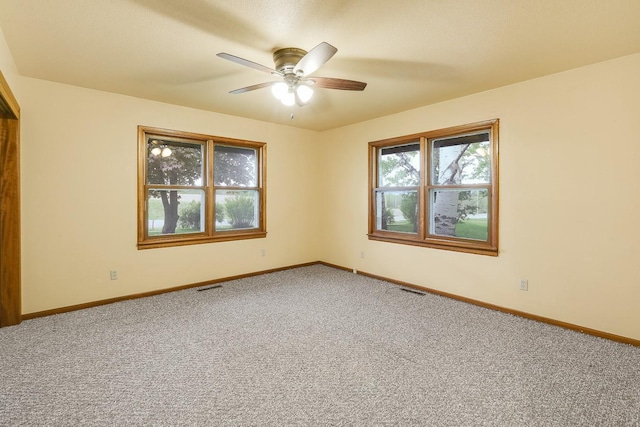 2226 Idaho Dr, Pella, IA 50219 - unfurnished room featuring carpet, a ceiling fan, and baseboards