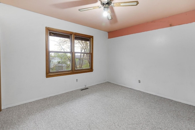 2226 Idaho Dr, Pella, IA 50219 - unfurnished room featuring carpet flooring, a ceiling fan, and baseboards