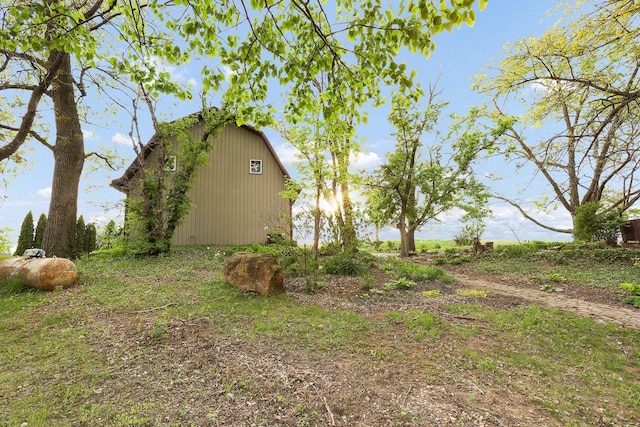 2226 Idaho Dr, Pella, IA 50219 - view of home's exterior with a barn and an outbuilding