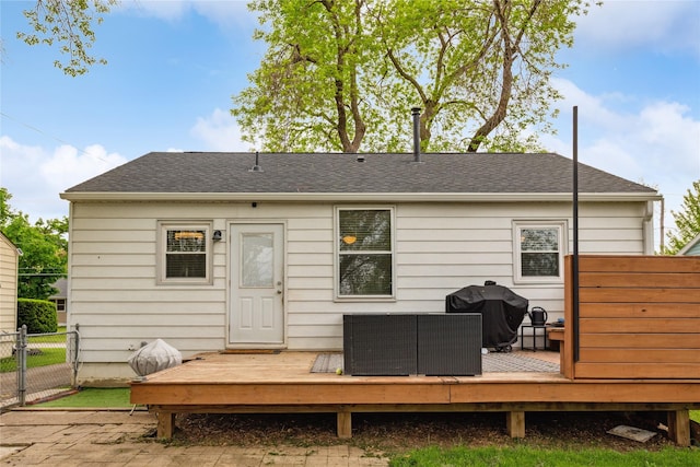 2012 61st St, Des Moines, IA 50322 - rear view of property with fence, a deck, a shingled roof, and a gate
